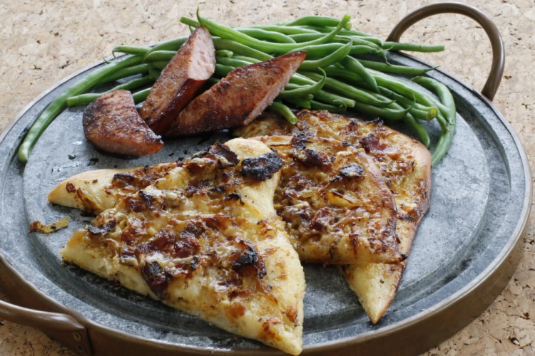 Alsatian onion pie with green beans and sausage has a powerful combination of simplicity and big flavor.
