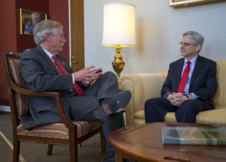Judge Merrick Garland, right, President Barack Obama's choice to replace the late Justice Antonin Scalia on the Supreme Court, meets with Sen. Angus King, I-Maine, on Capitol Hill in Washington on Wednesday.