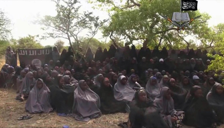 This image taken from a May 12, 2014 video by Nigeria's Boko Haram terrorist network, shows the alleged missing girls abducted from the northeastern town of Chibok. A schoolmate says she cried with joy when she saw a Boko Haram video appearing to show some of Nigeria's kidnapped Chibok girls.