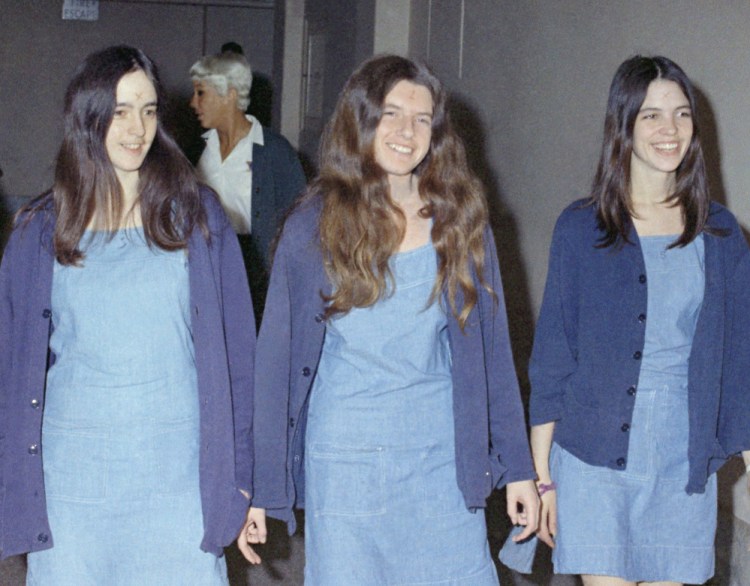 Charles Manson followers, from left, Susan Atkins, Patricia Krenwinkel and Leslie Van Houten walk to court to appear for their roles in the 1969 cult killings of seven people, including pregnant actress Sharon Tate, in Los Angeles, Calif., in August 1970.