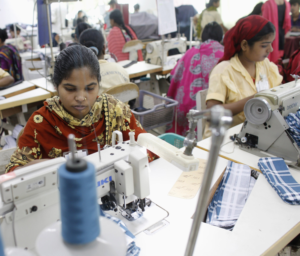 Employees work in a factory of Babylon Garments on the outskirts of Dhaka, the capital of Bangladesh, in January 2014.