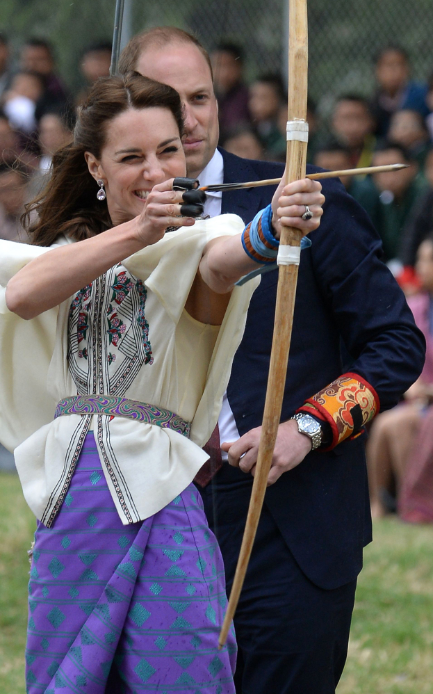 Kate, Duchess of Cambridge, takes part in an archery event as her husband, Prince William, looks on in Thimphu, Bhutan on Thursday.
