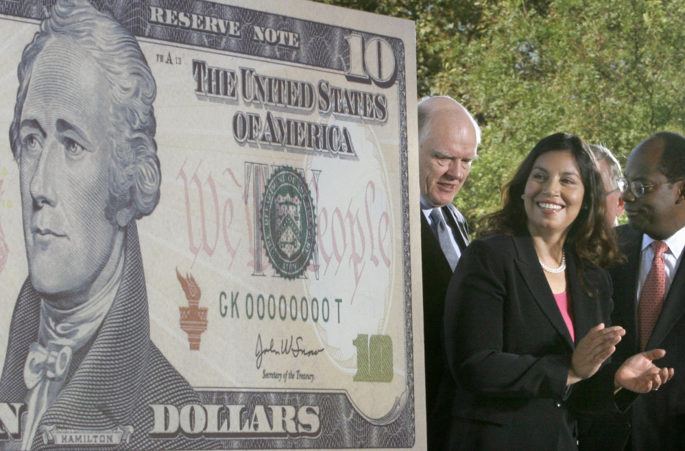 Treasury officials unveil the $10 bill featuring the face of Alexander Hamilton in 2005. The hit musical "Hamilton" has sparked renewed interest in keeping him on the bill.