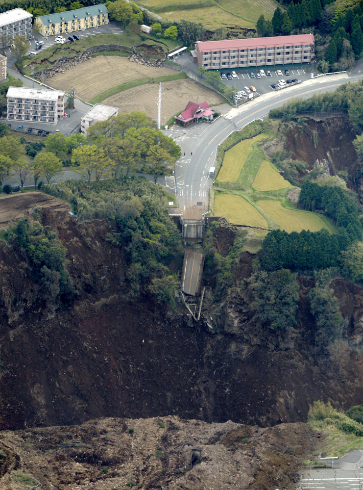 A bridge is cut off by landslides after the earthquake in Minamiaso, Kumamoto prefecture, Japan, Saturday.