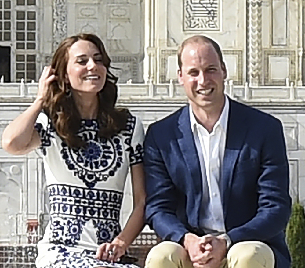 Britain's Prince William, and his wife, Kate, the Duchess of Cambridge, pose in front of the Taj Mahal in Agra, India, on Saturday. Agra is the last stop on the royal couple's weeklong visit.
