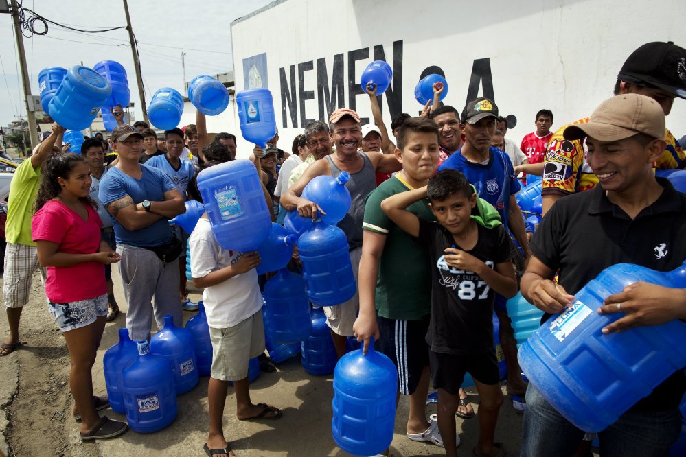 Survivors stand in line to buy potable water Monday in Manta, Ecuador. Saturday's 7.8-magnitude quake was the worst to hit the nation since one in 1949 that killed 5,000.
