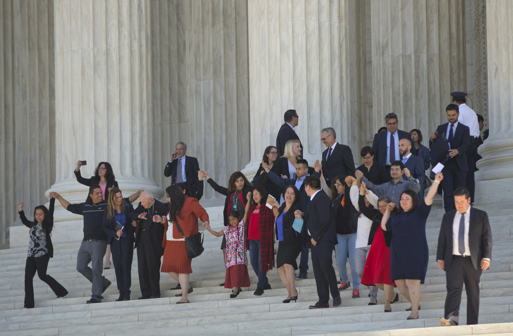 Supporters of immigration reform leave after hearing arguments at the Supreme Court in the case U.S. versus Texas Monday. The Supreme Court is taking up an important dispute over immigration that could affect millions of people.