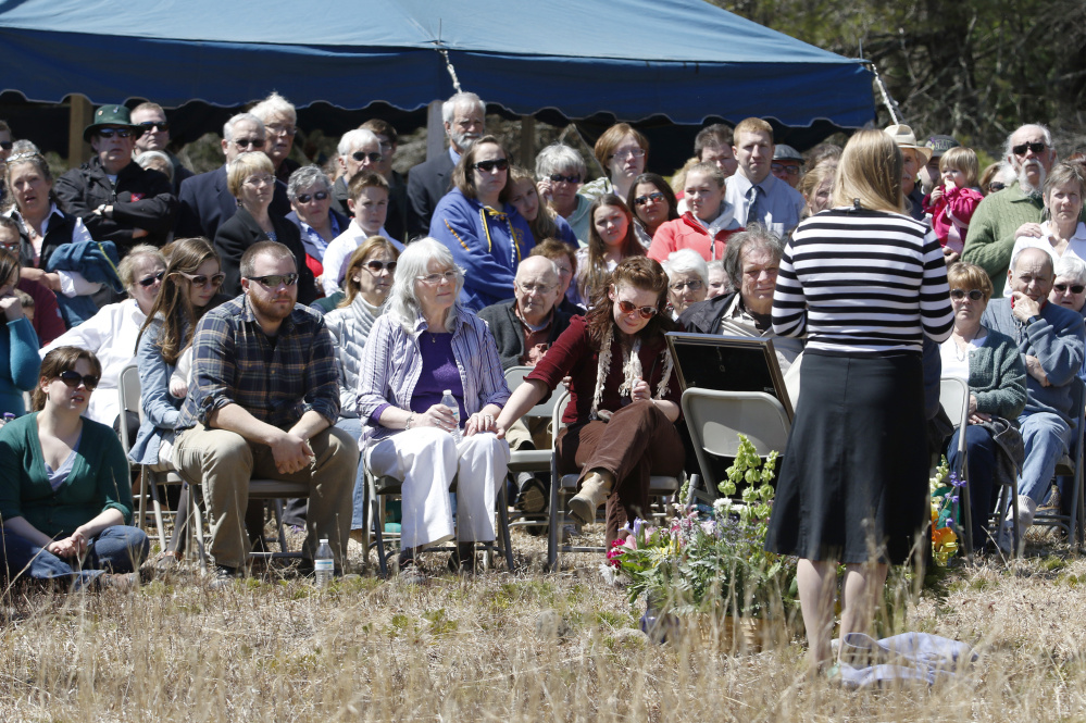 Elizabeth Perron, right, wife of crash victim Adam Perron, addresses the crowd Sunday at a memorial service for her husband at the Holt Pond Preserve in Naples. "Learning was his passion to a point he wasn't able to control. He was my own personal encyclopedia," she said.
Joel Page/Staff Photographer