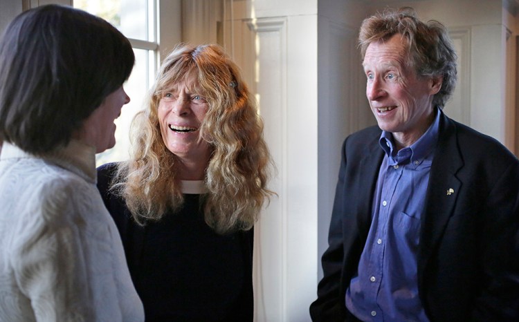 Roberta "Bobbi" Gibb, center, the first woman to run the entire course in the Boston Marathon, and Bill Rodgers, right, four-time winner of the race, speak with state Rep. Carolyn Dykema, D-Holliston, in Hopkinton, Mass., in this April 13, 2016, photo. The Associated Press