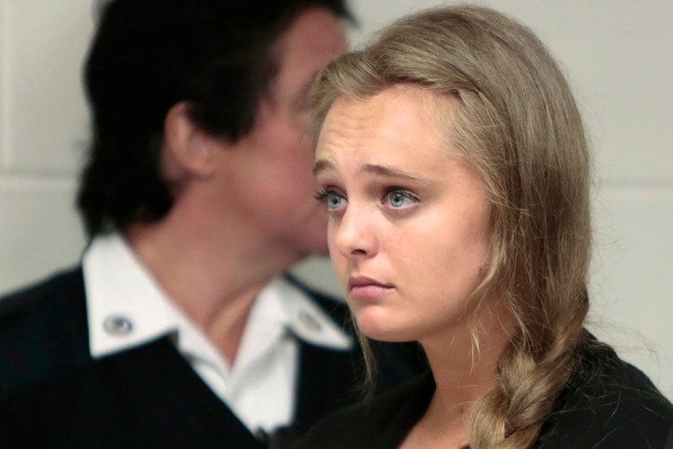 Michelle Carter listens to arguments in Juvenile Court in New Bedford, Mass., on Aug. 24, 2015. Carter is charged with involuntary manslaughter for allegedly pressuring Conrad Roy III to commit suicide in 2014. Peter Pereira/Standard Times via AP