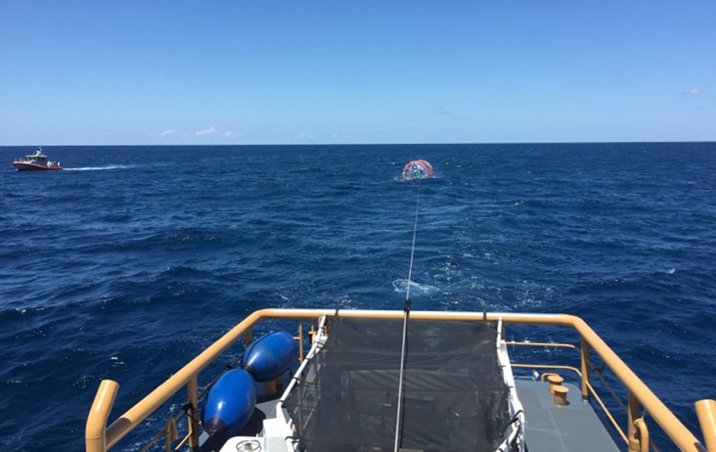 The Coast Guard Cutter Gannet tows Reza Baluchi's  "hydro pod" off the coast of Jupiter, Fla. The adventure runner was rescued for the second time on Sunday. Photo courtesy U.S. Coast Guard 