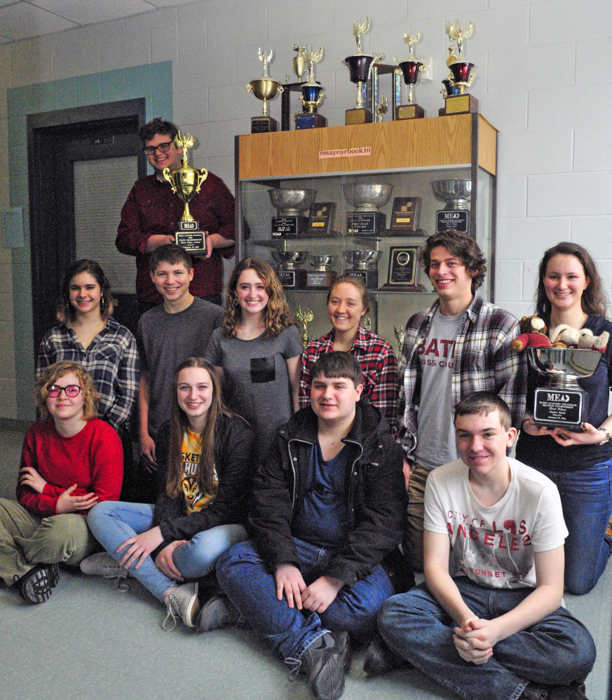 State champion Academic Decathlon team from Monmouth Academy shows off the school's fifth state championship trophy in the event on March 2. The team returned Sunday from Alaska where they placed seventh in the small school division. Members of the team are from left, front row, Liliana Stewart, Maddie Amero, Chris Dumont, Gerard Boulet; second row, Emmeline Willey, Dylan Goff, Sammy Grandahl, Madi Bumann, Luke Thombs, Becky Bryant; back row Corey Tartarka.