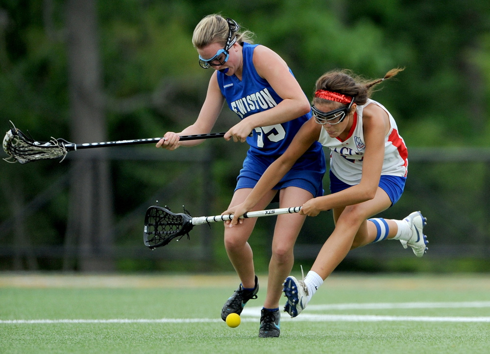 Lewiston's Allison Frechette, left, battles for the ball with Messalonskee's India Languet during an Eastern A semifinal last season at Thomas College in Waterville. Languet has elevated her gamr in the midfield with Nathalie St. Pierre out with an inkle injury.