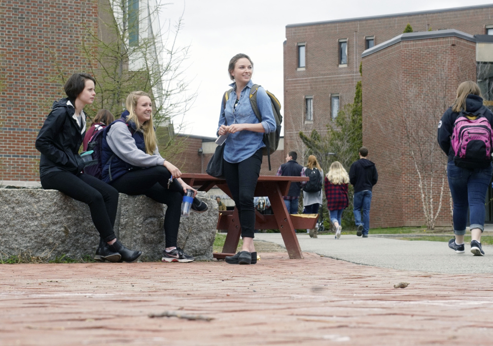 University of Maine students gather on campus Tuesday in Orono. The number of out-of-state students at UMaine is rising from 731 last year to at least 1,123 in 2016-17, helping to reverse a trend of flagging enrollment. Our graphic charts recent nonresident admissions, A8