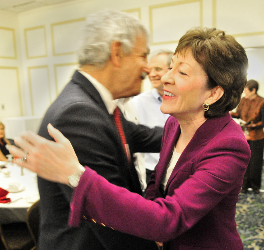 Sen. Roger Katz, R-Augusta, and U.S. Sen. Susan Collins, R-Maine, hug before a Kennebec Valley Chamber of Commerce event on Wednesday at the Senator Inn & Spa in Augusta.