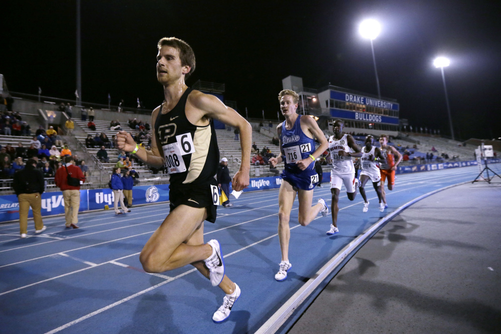 Purdue senior Matt McClintock, left, leads Drake's Reed Fischer during the men's 5,000-meter run at the Drake Relays athletics meet on April 28 in Des Moines, Iowa.
