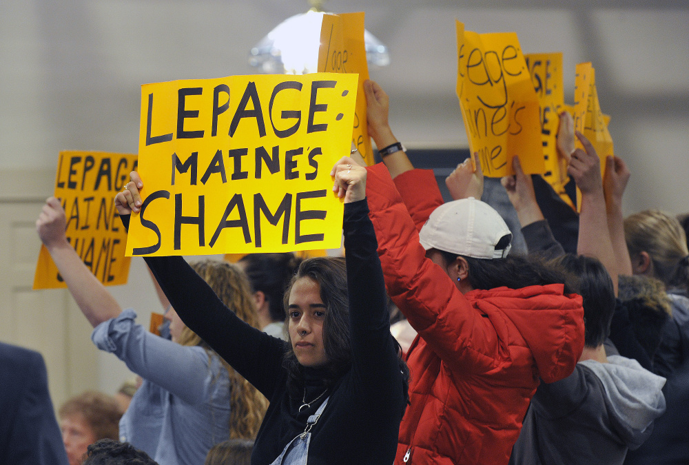 LEWISTON, ME - MAY 4: A group of college age students protest Gov. Paul LePage as he holds a town hall meeting in Lewiston Wednesday, May 4, 2016. The group was escorted from the event. (Photo by Shawn Patrick Ouellette/Staff Photographer)