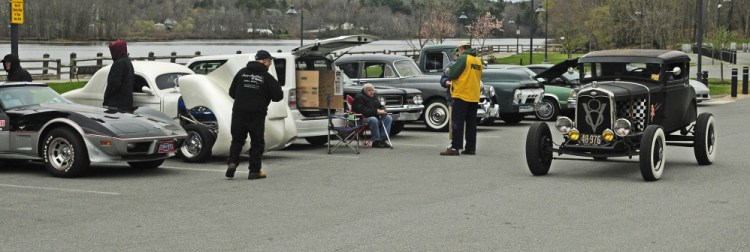 A hot rod leaves the parking lot Thursday during the first Classic Cruise-In Night in the Gardiner Waterfront Park.