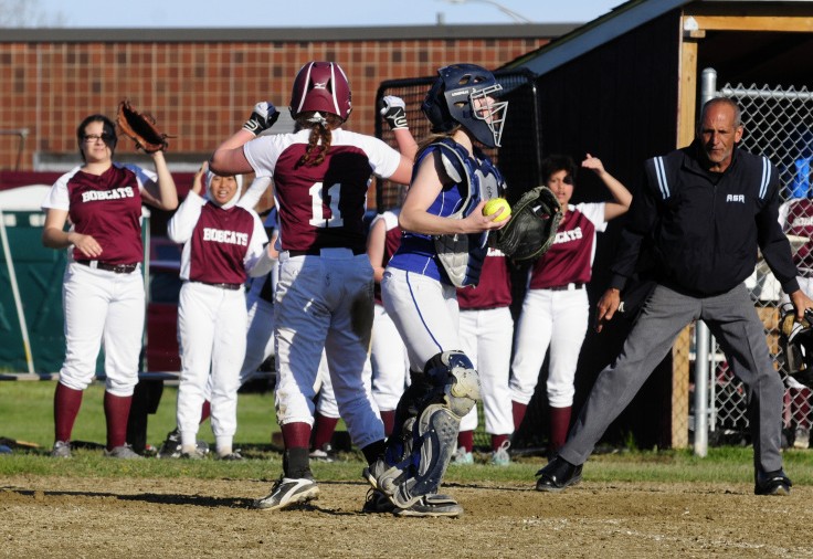 Members of the Richmond softball team jump for joy after Cassidy Harriman scored the winning run in the bottom of the seventh inning Friday in Richmond. Sacopee catcher Grace Sanborn stands at plate.