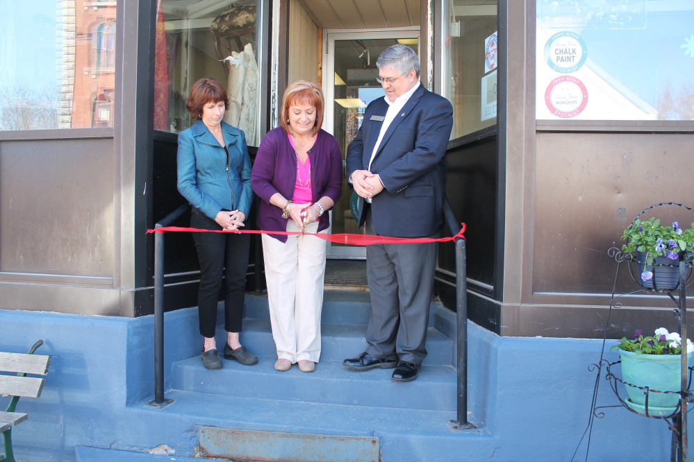 From left to right, Winthrop Lakes Region Chamber Director Barbara Walsh, Cindy Gervais, owner of Vintage Collectibles & Indoor Market, and Kennebec Valley Chamber of Commerce President Ross Cunningham recently attended the market's grand opening at 129 Main St. in Winthrop.