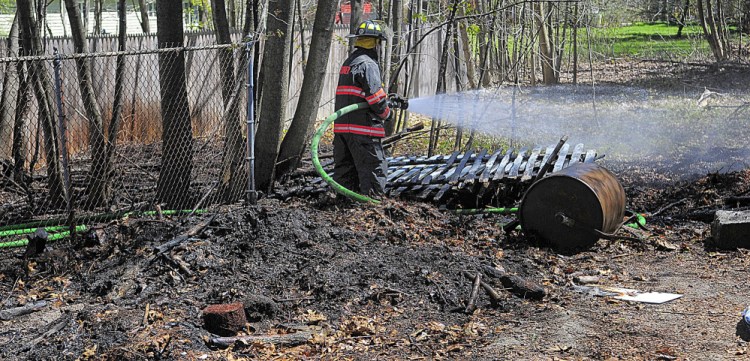 Gardiner firefighter Roy Girard was one of several area firefighters who responded on Tuesday to a report of a small brush fire on Pleasant Street in Gardiner.