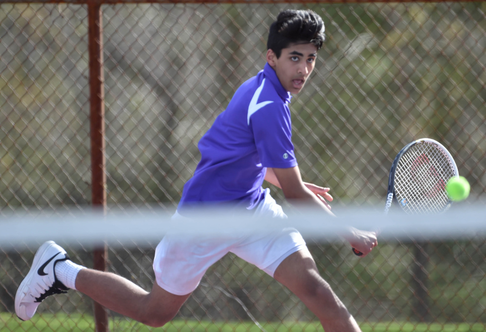Waterville's Mohammad Ali Sheikh returns a serve from Belfast's  Jordan Bickford during a tennis match Tuesday at the North Street courts in Waterville. Bickford won 6-2, 4-6, 6-2.