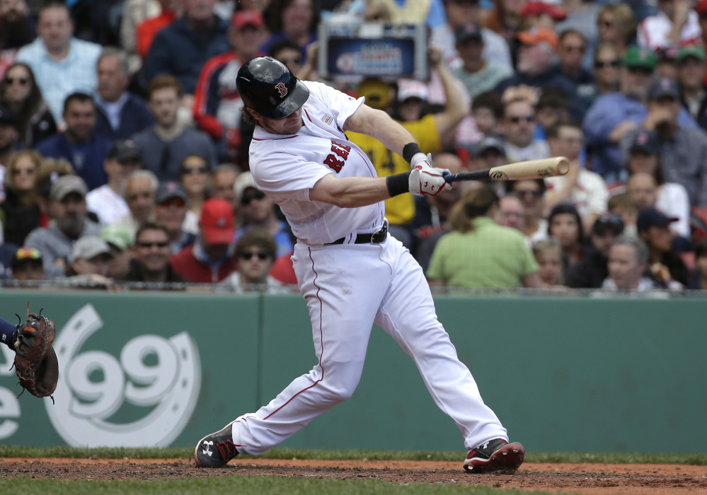 Boston's Ryan Hanigan hits an RBI single in the third inning against the Houston Astros on Sunday at Fenway Park in Boston.