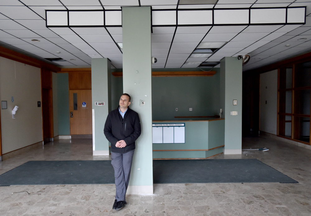 Tom Siegel stands in the lobby of the former Seton Hospital earlier this month in Waterville. The City Council on Tuesday voted on a tax increment financing deal so Siegel can renovate the building, turning it into office space and apartments.