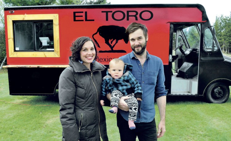 Anne Holloway and Garnet Keim and their son Aero, of Weld, pose outside their food truck, which will debut this summer in Franklin County. They also have a son Jude, 3.