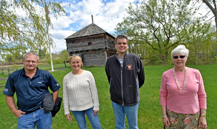 Fort Halifax Days committee members, from left, Ray Caron, Karen Rancourt-Thomas and Jim Bourgoin stand with Virginia Sturies, right, on Thursday in front of Fort Halifax in Winslow.
