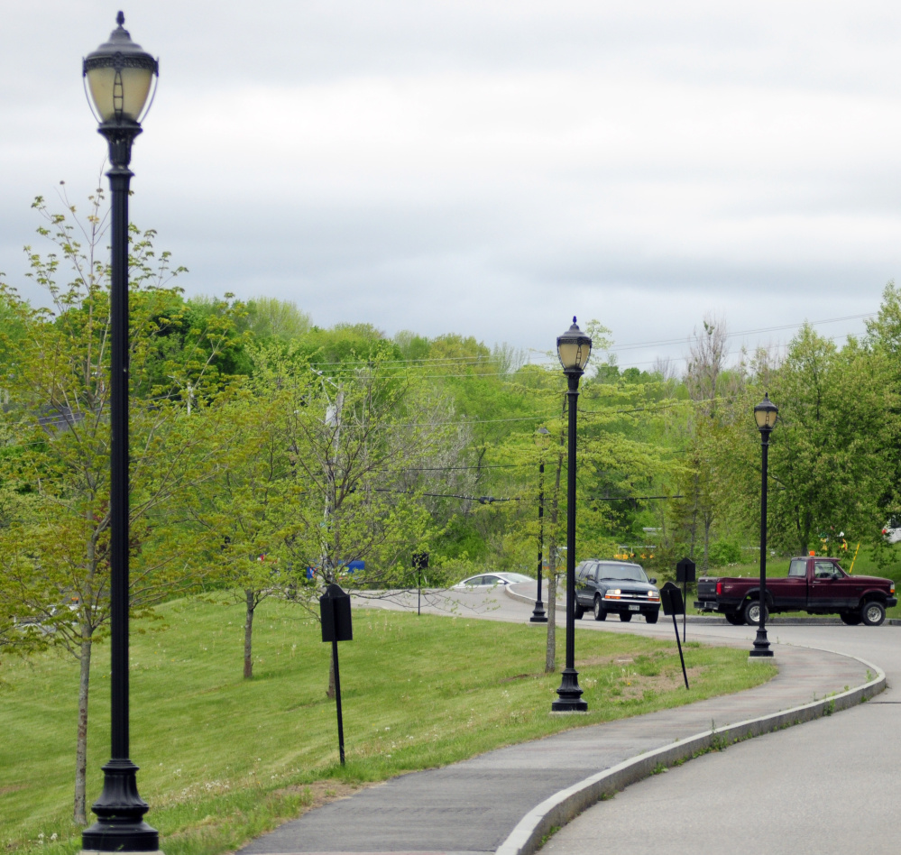 Street lights on Canal Street in Augusta, shown in this Tuesday photo, would be replaced with energy-efficient bulbs under a proposal before Augusta City Council.