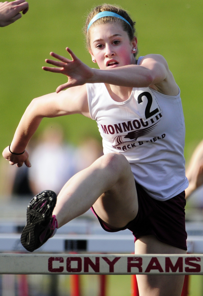 Monmouth Academy's Emily Grandahl runs 100 meter hurdles during a meet last Friday at Alumni Field in Augusta.
