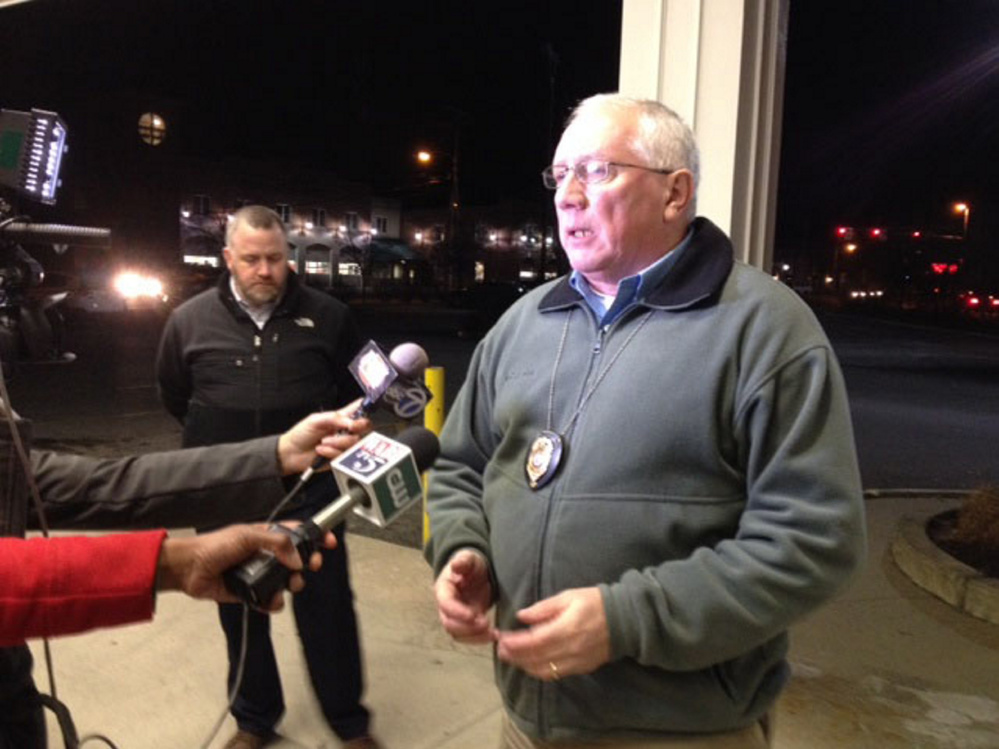 Police Chief Joseph Massey, right, speaks to reporters in December during a night-long standoff as Deputy Chief Charles Rumsey listens in background. Rumsey is leaving next week to become chief in Cumberland, and Massey has asked city councilors to fill the $92,000-a-year position, which he said is crucial to running the department.
