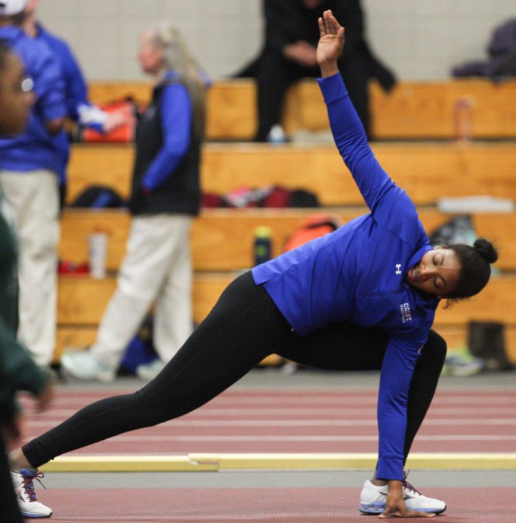 Kim Donaldson stretches before a meet recently. The Colby senior is headed to the NCAA Division III nationals despite this being her first season throwing the shot. (Contributed photo)