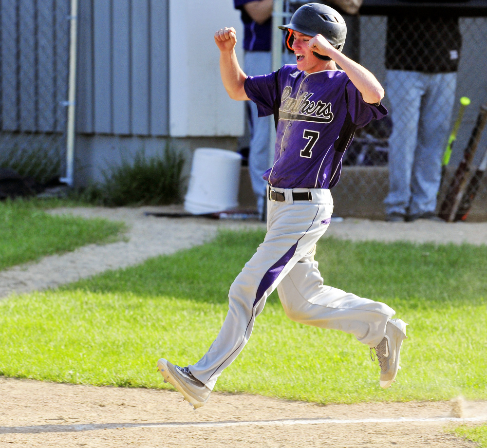 Waterville pinch runner Kody Vallee celebrates as he heads home to score the tying run on a single by Andrew Roderigue in the top of the seventh inning during a Kennebec Valley Athletic Conference Class B game against waterville on Friday in Readfield.