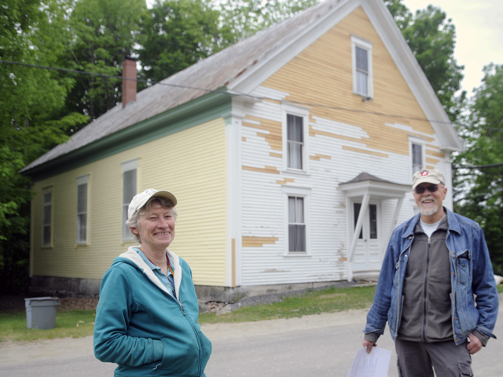 The Vienna Union Hall that stands behind Marianne Archard, president of the Vienna Union Hall Association, and her husband, John Archard, on Sunday is receiving a new coat of paint.