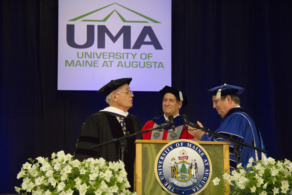 Professor Barry Farber, left, accepts his Honorary Doctorate of Humane Letters from UMA Provost Joseph Szakas, middle, and UMA President James Conneely.