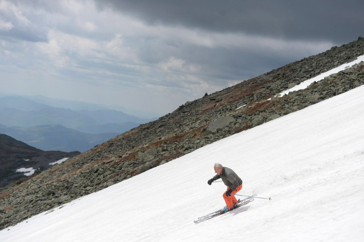 John Christie, then 78, skis down a snowfield near the top of Mount Washington in May of 2015. "He was a true lover of skiing," said Bruce Miles, president of the Sugarloaf Ski Club.
Shawn Patrick Ouellette/Staff Photographer