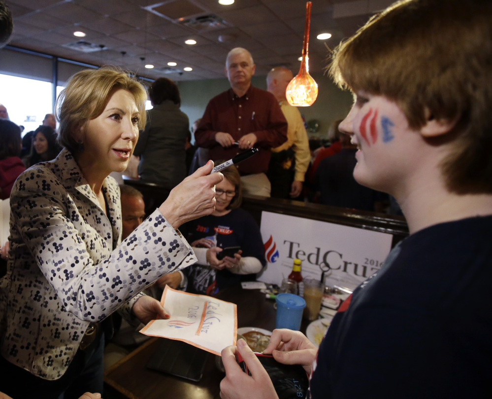 Vice-presidential candidate Carly Fiorina talks with Catrin Moore during a campaign stop at Lincoln Square Pancake House on Tuesday in Westfield, Ind.