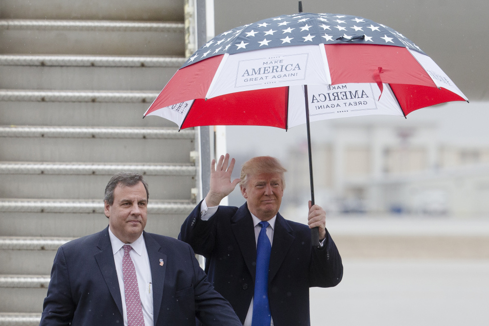Republican presidential candidate Donald Trump has chosen New Jersey Gov. Chris Christie, left, to lead his White House transition team should Trump win the general election in November.