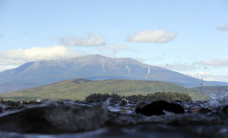 Mount Katahdin in Baxter State Park looms over Lake Millinocket. Conservationist Roxanne Quimby has offered to donate 87,500 acres east of Baxter to the government for a national park, igniting a public debate.