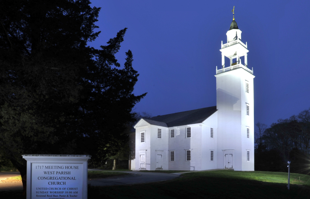 Dusk settles over the West Parish Church in West Barnstable, Mass. The church celebrated its 400th anniversary Sunday with a special service re-enacting worship in 1717, complete with parishioners in period costumes and appropriate props of the era.