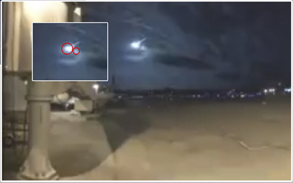 The American Meteor Society determined that the meteoroid seen over the northeastern part of the United States on Tuesday morning broke into two pieces. This is from the Burlington, Vt., airport video that shows the two objects. The inset enlarges the image and the circles indicate the two pieces.