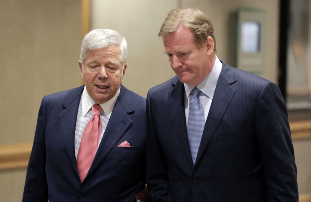 Robert Kraft, owner of the New England Patriots, left, talks with NFL Commissioner Roger Goodell while arriving at the NFL football owners meetings in Indianapolis, Tuesday, May 24, 2011. On Wednesday, Kraft and the Patriots joined Tom Brady in supporting the appeal of Brady's four-game suspension. (The Associated Press)