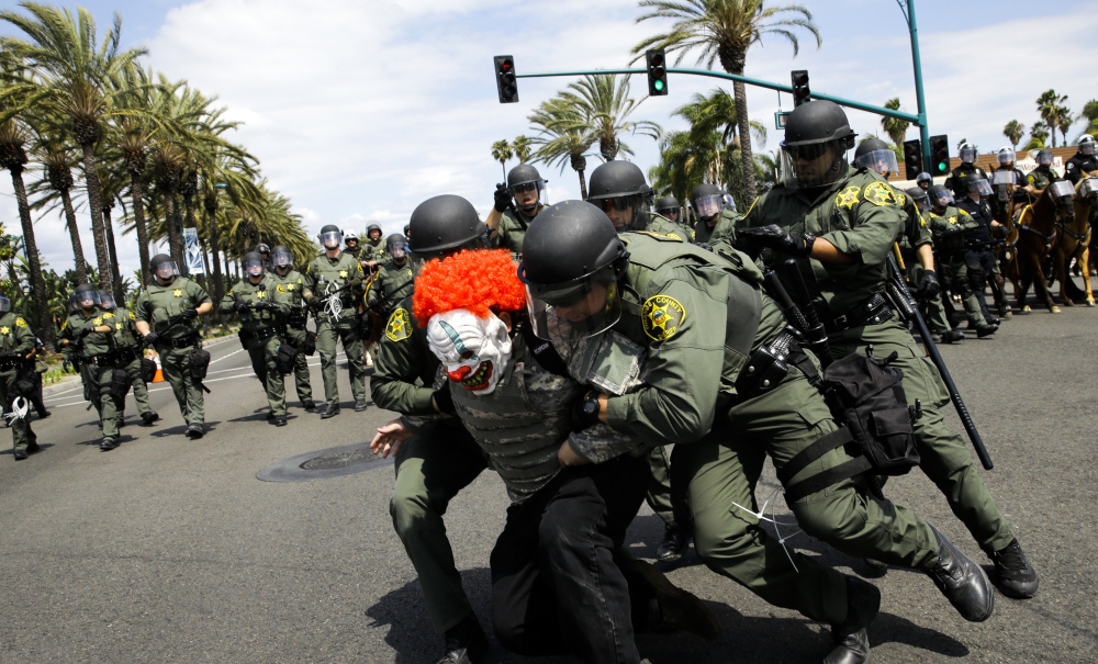 Orange County, California, sheriff's deputies take a protester into custody outside the convention center where presidential candidate Donald Trump held a rally Wednesday.