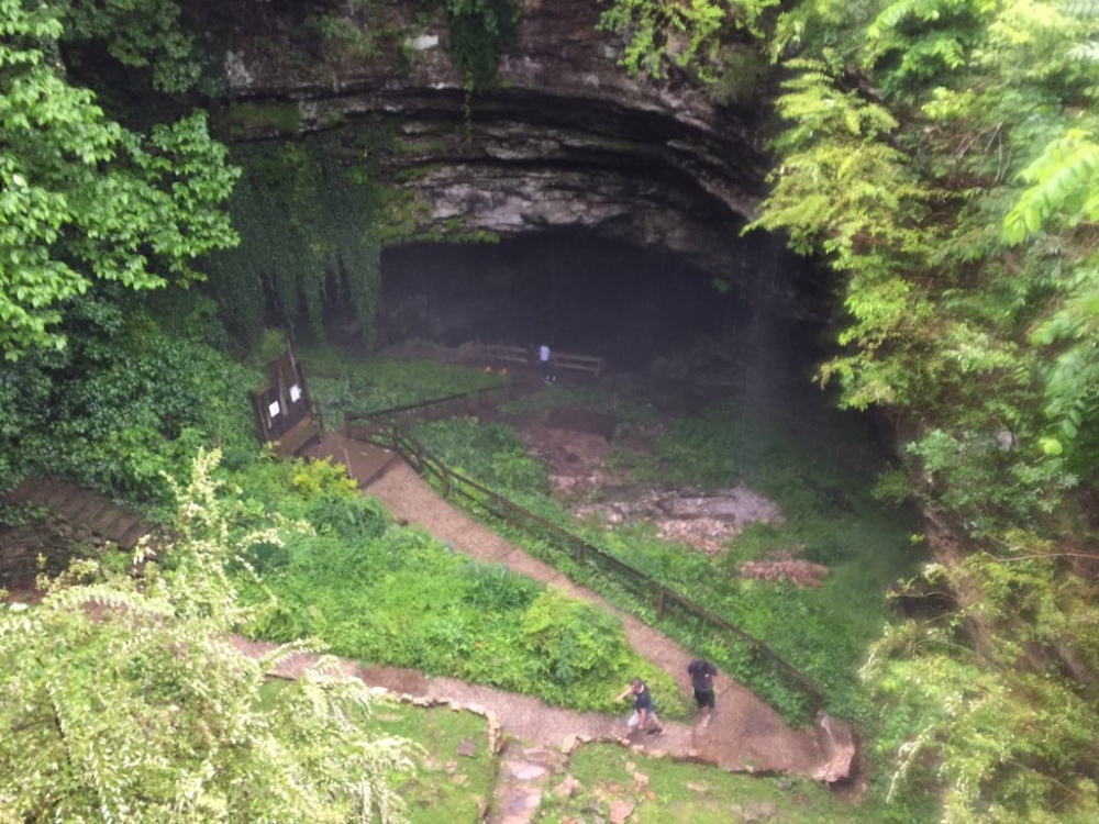People leave the Hidden River Cave in Kentucky on Thursday after officials said a group exploring the cave got trapped by rising water caused by heavy rains.