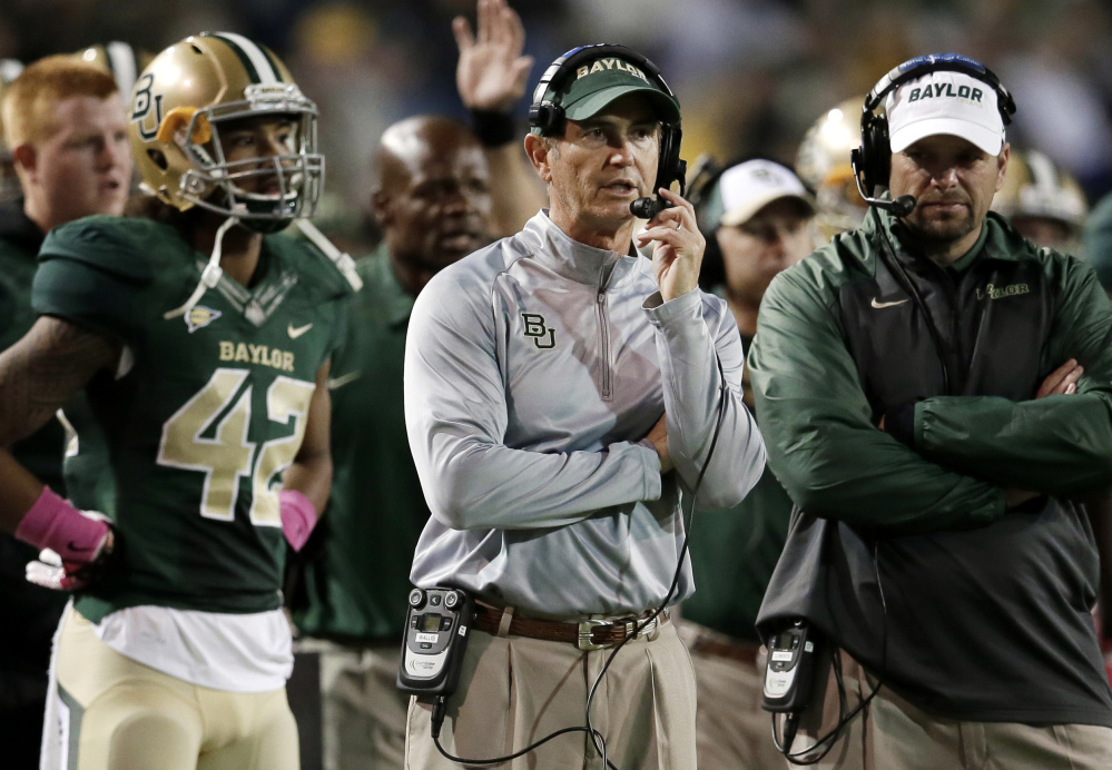 Baylor football coach Art Briles, center, was fired Thursday in response to questions about the program's handling of sexual assault complaints against players.