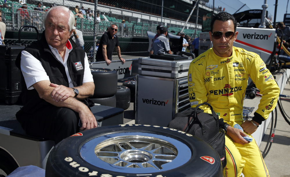 Car owner Roger Penske, left, seen Thursday with driver Helio Castroneves of Brazil during a practice session for the Indianapolis 500, is regarded as one of the most influential – and respected – nondrivers at Indianapolis Motor Speedway.