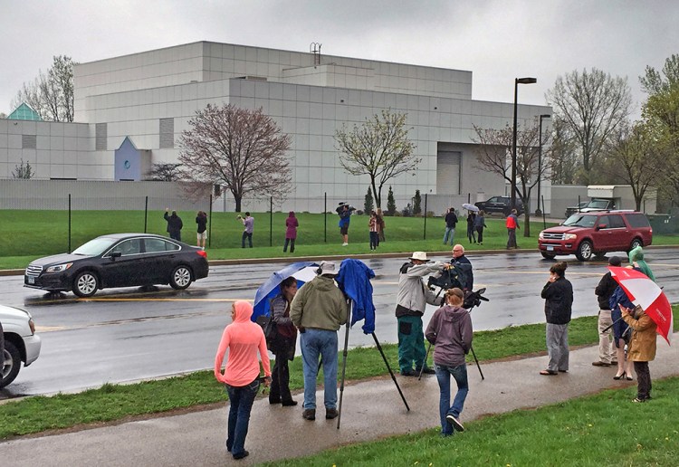 People stand outside  Prince's Paisley Park compound in Chanhassen, Minn., In this photo taken on April 21, 2016, the day the pop singer was found dead in an elevator there. Jim Gehrz/Star Tribune via AP
