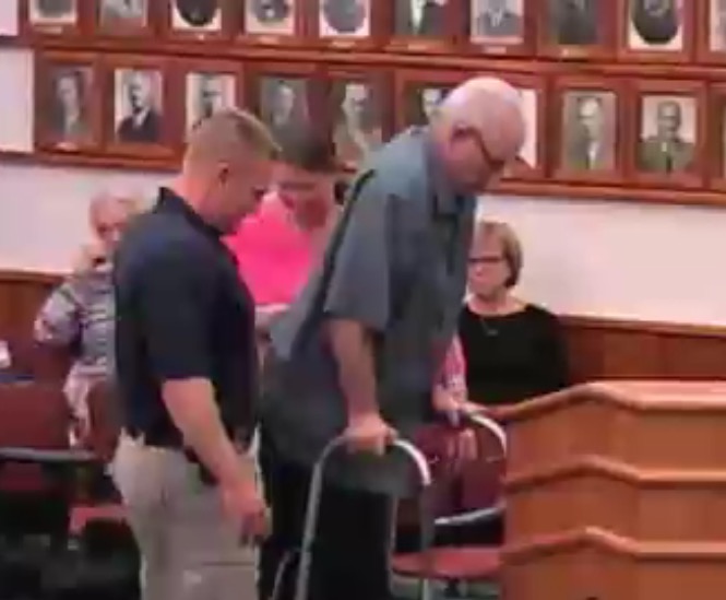 For the first time since a 2014 motorcycle crash left  Augusta police chief paralyzed, Robert Gregoire walks to the podium at a council meeting. 